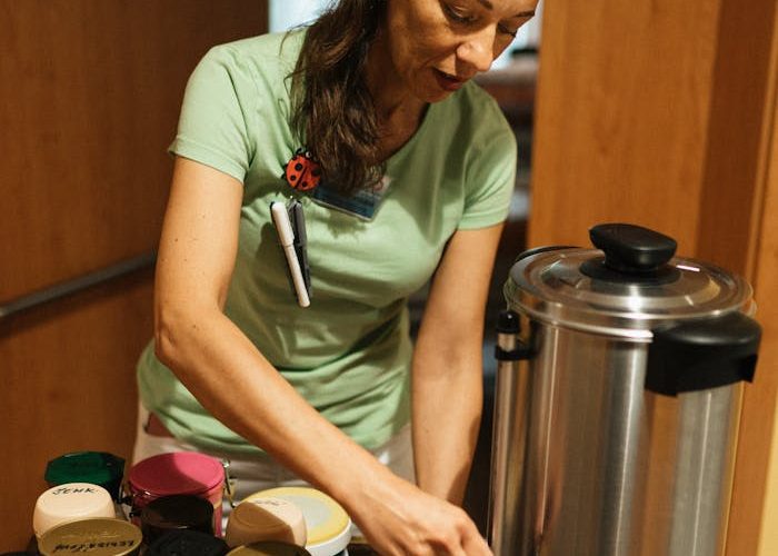 Caregiver Pouring Coffee in Cup